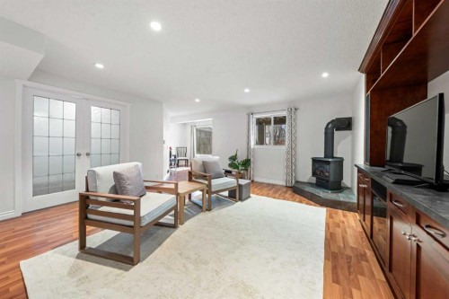 42 Tuscany Meadows Bay Nw, Calgary, AB - Indoor Photo Showing Living Room With Fireplace