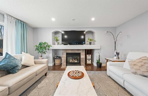 42 Tuscany Meadows Bay Nw, Calgary, AB - Indoor Photo Showing Living Room With Fireplace
