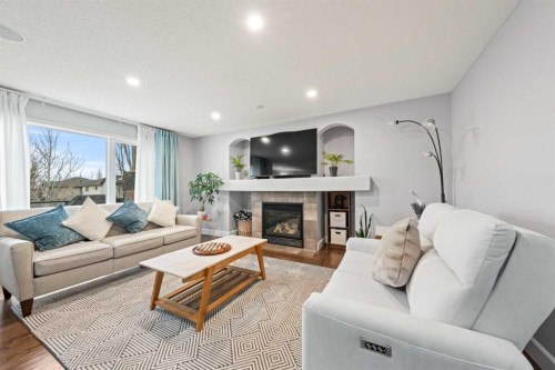 42 Tuscany Meadows Bay Nw, Calgary, AB - Indoor Photo Showing Living Room With Fireplace