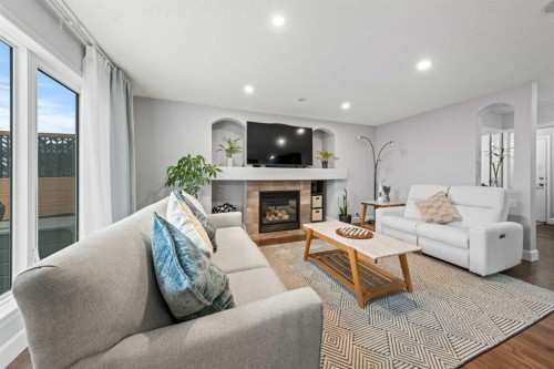 42 Tuscany Meadows Bay Nw, Calgary, AB - Indoor Photo Showing Living Room With Fireplace