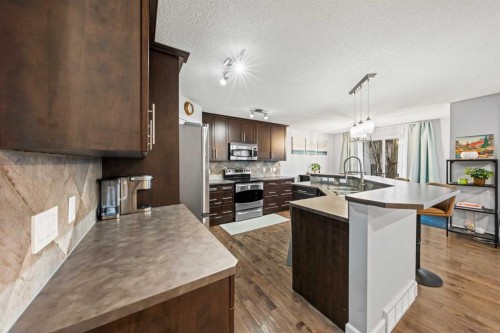 42 Tuscany Meadows Bay Nw, Calgary, AB - Indoor Photo Showing Kitchen With Upgraded Kitchen
