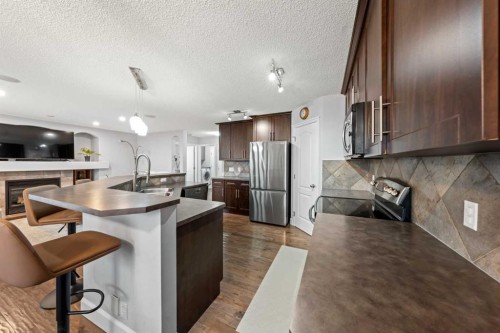 42 Tuscany Meadows Bay Nw, Calgary, AB - Indoor Photo Showing Kitchen With Double Sink