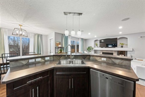 42 Tuscany Meadows Bay Nw, Calgary, AB - Indoor Photo Showing Kitchen With Double Sink