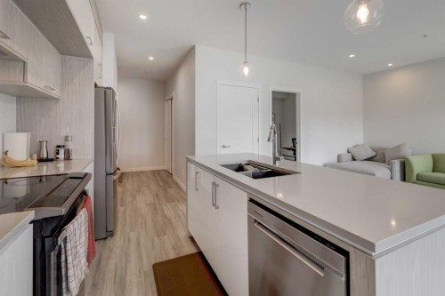 315-138 Sage Valley Common Nw, Calgary, AB - Indoor Photo Showing Kitchen With Double Sink With Upgraded Kitchen