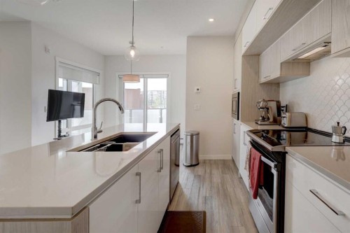 315-138 Sage Valley Common Nw, Calgary, AB - Indoor Photo Showing Kitchen With Stainless Steel Kitchen With Double Sink With Upgraded Kitchen