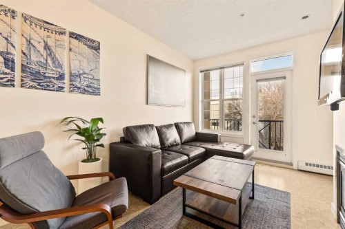 311-208 Holy Cross Lane Sw, Calgary, AB - Indoor Photo Showing Living Room