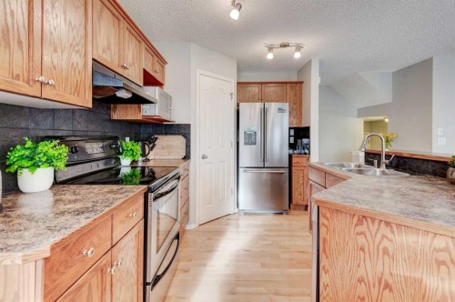 167 Springborough Way Sw, Calgary, AB - Indoor Photo Showing Kitchen With Stainless Steel Kitchen With Double Sink
