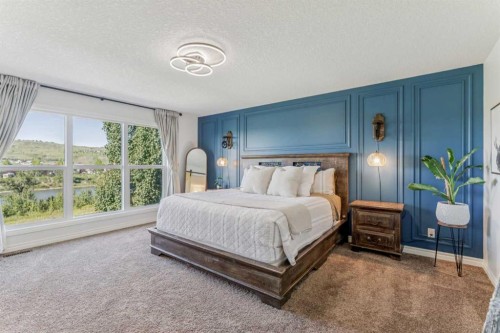 50 Riviera View, Cochrane, AB - Indoor Photo Showing Bedroom