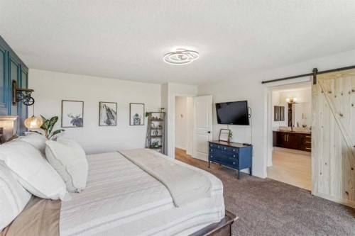 50 Riviera View, Cochrane, AB - Indoor Photo Showing Bedroom