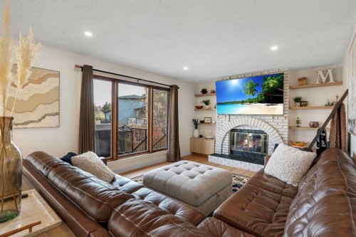 42 Douglas Woods Way Se, Calgary, AB - Indoor Photo Showing Living Room With Fireplace