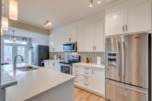 228 Sage Bluff Drive Nw, Calgary, AB - Indoor Photo Showing Kitchen With Double Sink With Upgraded Kitchen
