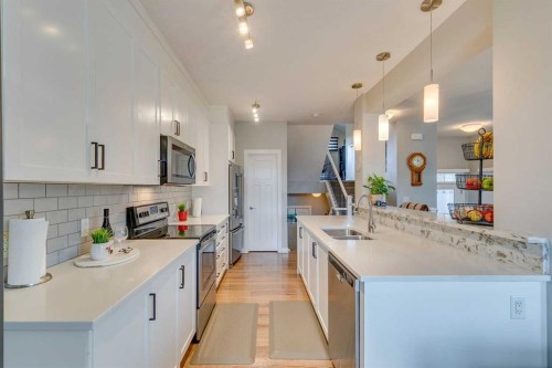 228 Sage Bluff Drive Nw, Calgary, AB - Indoor Photo Showing Kitchen With Double Sink With Upgraded Kitchen