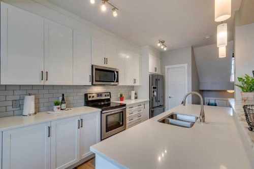 228 Sage Bluff Drive Nw, Calgary, AB - Indoor Photo Showing Kitchen With Double Sink With Upgraded Kitchen