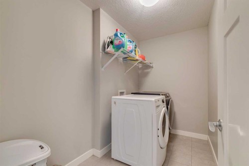 228 Sage Bluff Drive Nw, Calgary, AB - Indoor Photo Showing Laundry Room