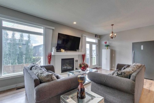 228 Sage Bluff Drive Nw, Calgary, AB - Indoor Photo Showing Living Room With Fireplace