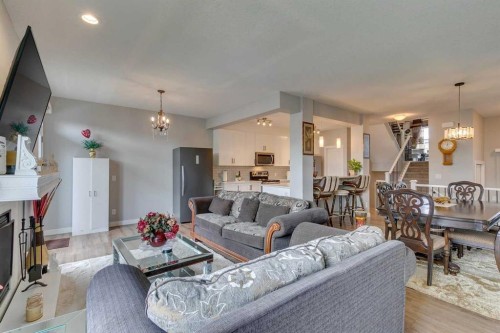 228 Sage Bluff Drive Nw, Calgary, AB - Indoor Photo Showing Living Room With Fireplace