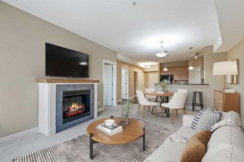 1243-2330 Fish Creek Boulevard Sw, Calgary, AB - Indoor Photo Showing Living Room With Fireplace