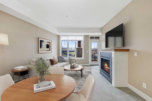 1243-2330 Fish Creek Boulevard Sw, Calgary, AB - Indoor With Fireplace