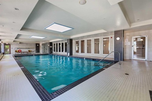 1243-2330 Fish Creek Boulevard Sw, Calgary, AB - Indoor Photo Showing Other Room With In Ground Pool