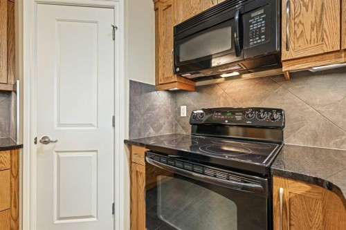 1243-2330 Fish Creek Boulevard Sw, Calgary, AB - Indoor Photo Showing Kitchen