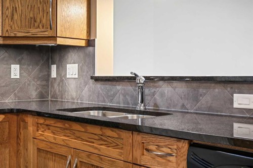 1243-2330 Fish Creek Boulevard Sw, Calgary, AB - Indoor Photo Showing Kitchen With Double Sink