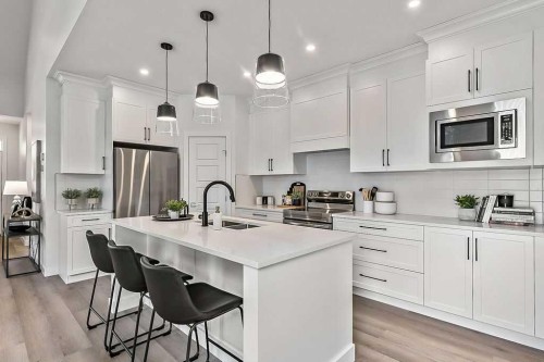 48 Drake Landing Square, Okotoks, AB - Indoor Photo Showing Kitchen With Stainless Steel Kitchen With Upgraded Kitchen