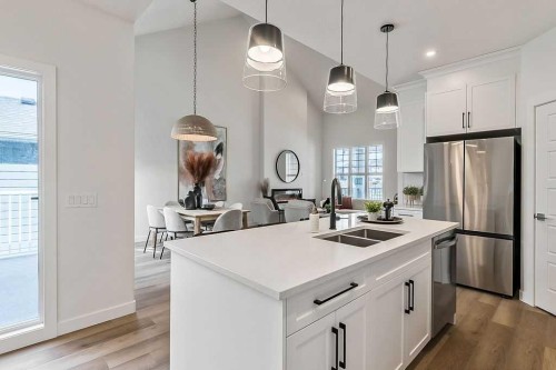 48 Drake Landing Square, Okotoks, AB - Indoor Photo Showing Kitchen With Stainless Steel Kitchen With Double Sink With Upgraded Kitchen