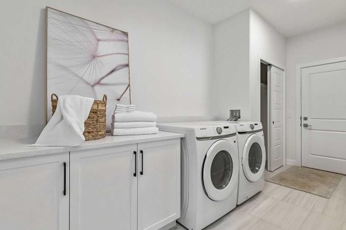 48 Drake Landing Square, Okotoks, AB - Indoor Photo Showing Laundry Room