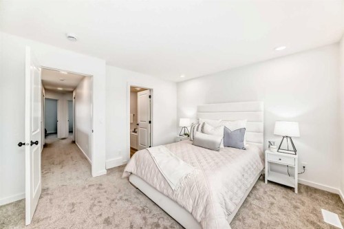 12 Starling Place Nw, Calgary, AB - Indoor Photo Showing Bedroom