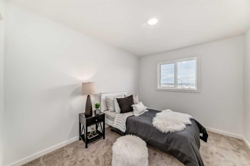 12 Starling Place Nw, Calgary, AB - Indoor Photo Showing Bedroom