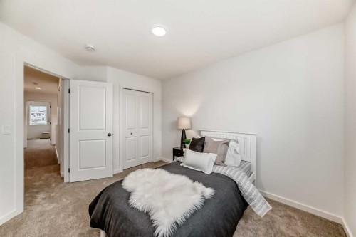 12 Starling Place Nw, Calgary, AB - Indoor Photo Showing Bedroom