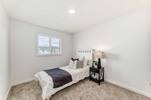 12 Starling Place Nw, Calgary, AB - Indoor Photo Showing Bedroom