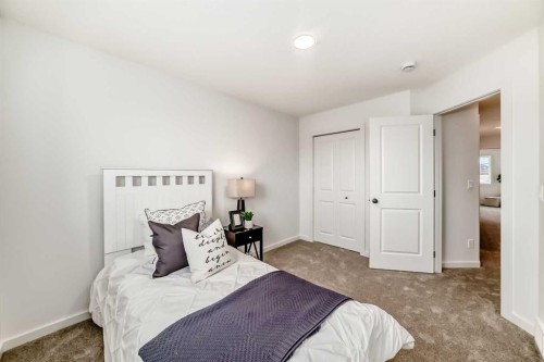 12 Starling Place Nw, Calgary, AB - Indoor Photo Showing Bedroom