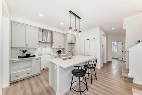 12 Starling Place Nw, Calgary, AB - Indoor Photo Showing Kitchen With Double Sink With Upgraded Kitchen