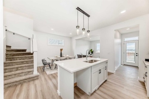12 Starling Place Nw, Calgary, AB - Indoor Photo Showing Kitchen With Double Sink