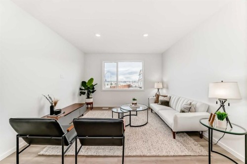 12 Starling Place Nw, Calgary, AB - Indoor Photo Showing Living Room