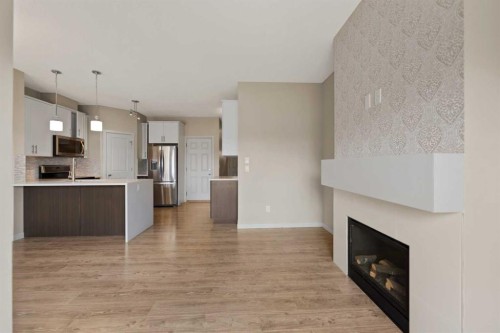 81 Copperpond Landing Se, Calgary, AB - Indoor Photo Showing Other Room With Fireplace