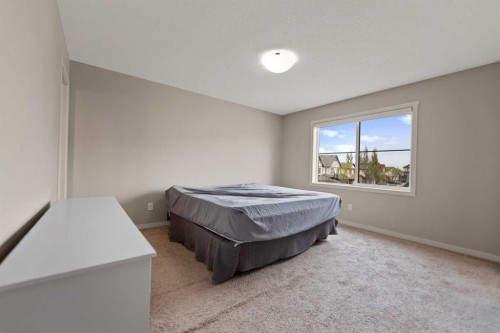 81 Copperpond Landing Se, Calgary, AB - Indoor Photo Showing Bedroom