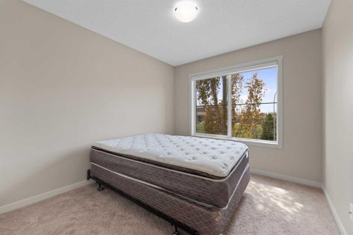 81 Copperpond Landing Se, Calgary, AB - Indoor Photo Showing Bedroom