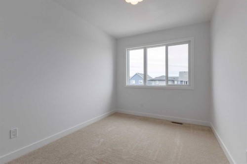 90 Agate Road, Cochrane, AB - Indoor Photo Showing Other Room