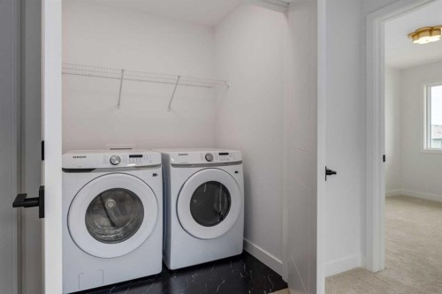 90 Agate Road, Cochrane, AB - Indoor Photo Showing Laundry Room