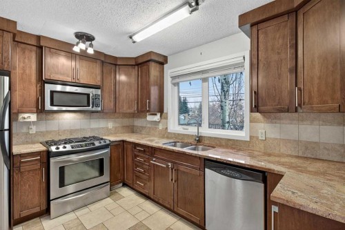 5020 Nemiskam Road Nw, Calgary, AB - Indoor Photo Showing Kitchen With Double Sink