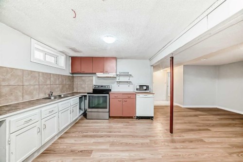 146 Dovertree Place Se, Calgary, AB - Indoor Photo Showing Kitchen With Double Sink