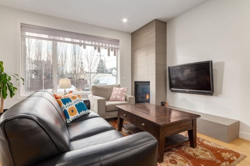 5016 17 Street Sw, Calgary, AB - Indoor Photo Showing Living Room With Fireplace