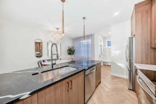 409 Clydesdale Avenue, Cochrane, AB - Indoor Photo Showing Kitchen With Double Sink With Upgraded Kitchen