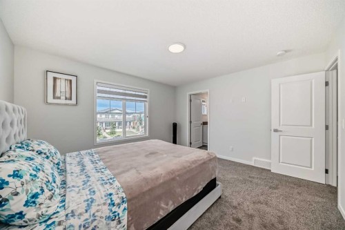 20 Creekstone Drive Sw, Calgary, AB - Indoor Photo Showing Bedroom