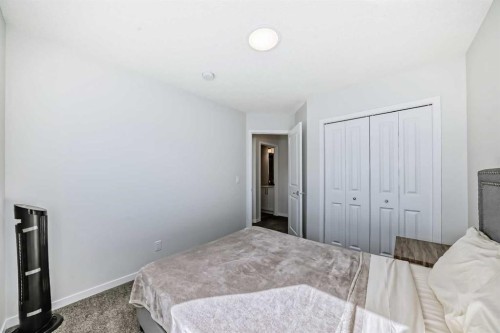 20 Creekstone Drive Sw, Calgary, AB - Indoor Photo Showing Bedroom