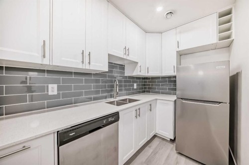 20 Creekstone Drive Sw, Calgary, AB - Indoor Photo Showing Kitchen With Stainless Steel Kitchen With Double Sink With Upgraded Kitchen