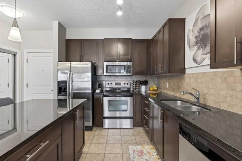 419-88 Arbour Lake Road Nw, Calgary, AB - Indoor Photo Showing Kitchen With Stainless Steel Kitchen With Double Sink With Upgraded Kitchen