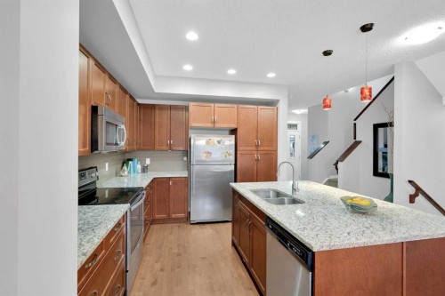 195 Marquis Common Se, Calgary, AB - Indoor Photo Showing Kitchen With Double Sink